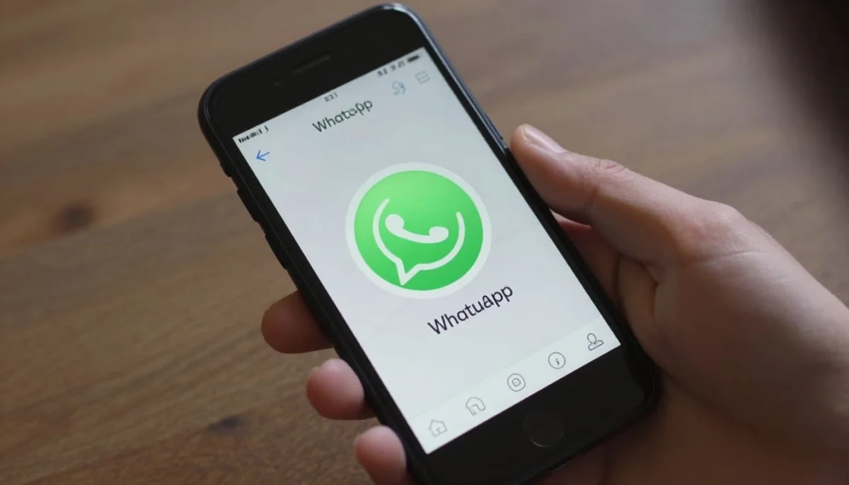 Close-up of a modern Android smartphone on a wooden table showing the fingerprint unlock process for a locked WhatsApp chat, with dramatic cinematic lighting, high contrast, shadows, and sharp focus on the fingerprint sensor.